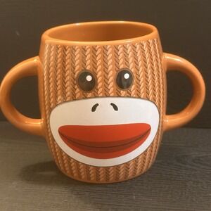 SOCK MONKEY DOUBLE HANDLE CERAMIC COFFE, TEA‎ MUG. BY GALERIE. VGC